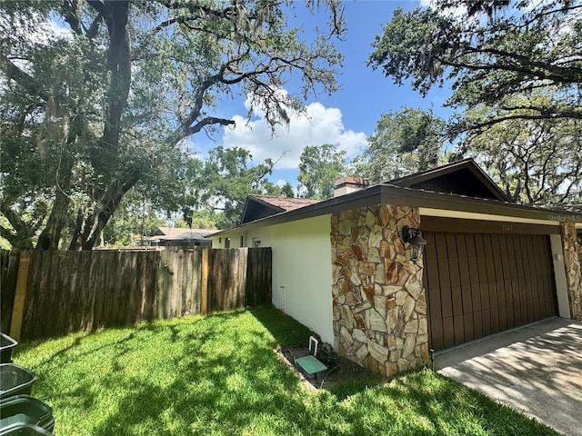 2102 Doefield Ct, Valrico, FL 33596 - view of side of home with stone siding and a chimney