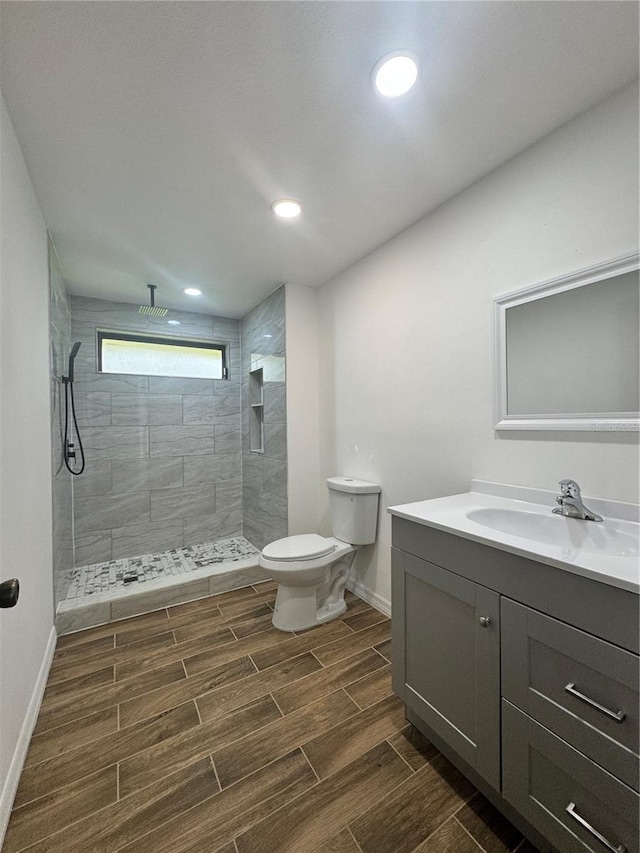 2102 Doefield Ct, Valrico, FL 33596 - full bath featuring vanity, wood finish floors, a walk in shower, and recessed lighting