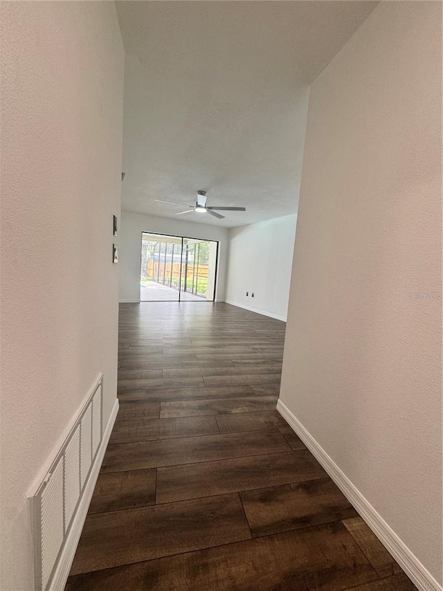 2102 Doefield Ct, Valrico, FL 33596 - hall with baseboards and dark wood-style flooring