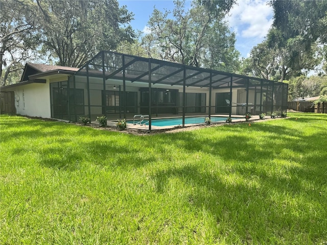 2102 Doefield Ct, Valrico, FL 33596 - back of property with a lawn, a lanai, and an outdoor pool