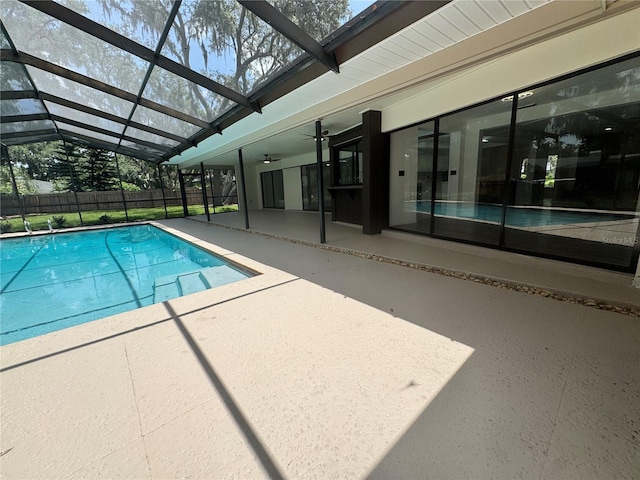2102 Doefield Ct, Valrico, FL 33596 - view of pool featuring a patio area, ceiling fan, and glass enclosure