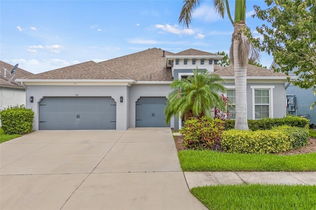 7114 Bowspirit Pl, Apollo Beach, FL 33572 - view of front facade featuring an attached garage, stucco siding, driveway, roof with shingles, and a chimney