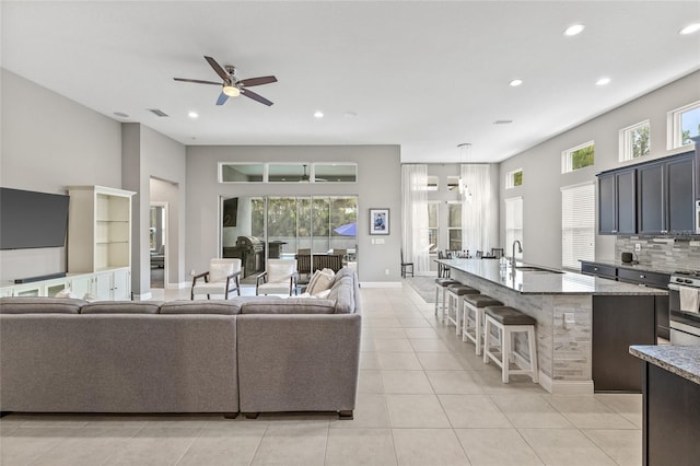 7114 Bowspirit Pl, Apollo Beach, FL 33572 - living room featuring ceiling fan, recessed lighting, and light tile patterned floors