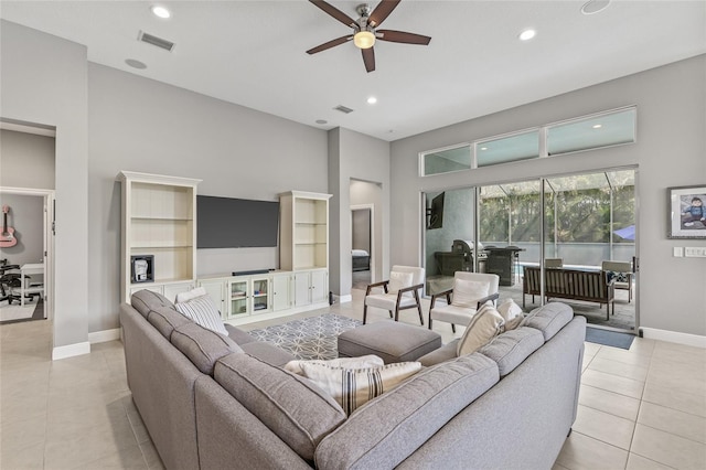 7114 Bowspirit Pl, Apollo Beach, FL 33572 - living area with ceiling fan, light tile patterned flooring, recessed lighting, and a towering ceiling