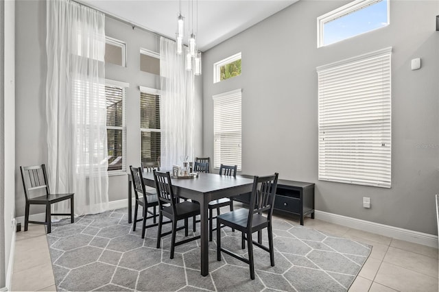 7114 Bowspirit Pl, Apollo Beach, FL 33572 - tiled dining area featuring a towering ceiling and baseboards