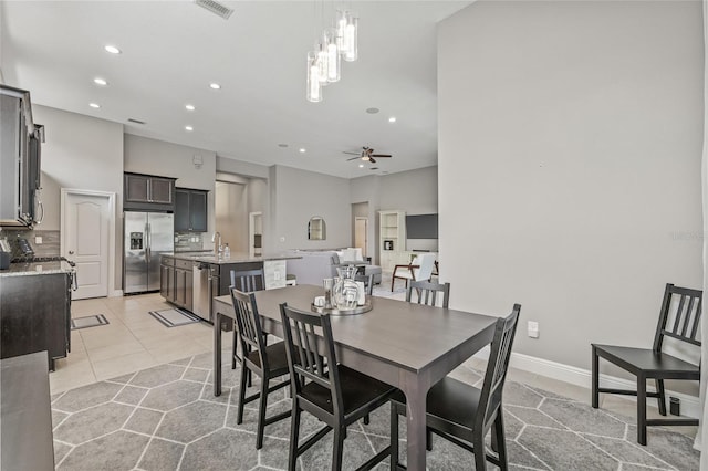 7114 Bowspirit Pl, Apollo Beach, FL 33572 - dining area with recessed lighting, ceiling fan, and light tile patterned floors
