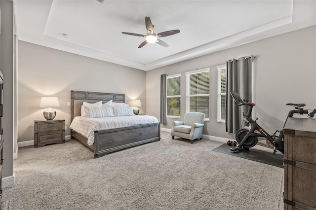 7114 Bowspirit Pl, Apollo Beach, FL 33572 - carpeted bedroom featuring a tray ceiling and ceiling fan