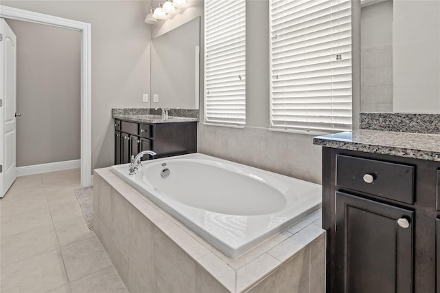 7114 Bowspirit Pl, Apollo Beach, FL 33572 - bathroom featuring a bath, vanity, and tile patterned floors