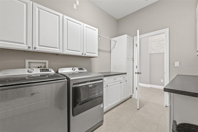 7114 Bowspirit Pl, Apollo Beach, FL 33572 - laundry area featuring independent washer and dryer, cabinet space, and light tile patterned floors