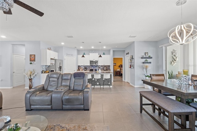 13301 Waterleaf Garden Cir, Riverview, FL 33579 - living area with a chandelier, light tile patterned flooring, a ceiling fan, and recessed lighting