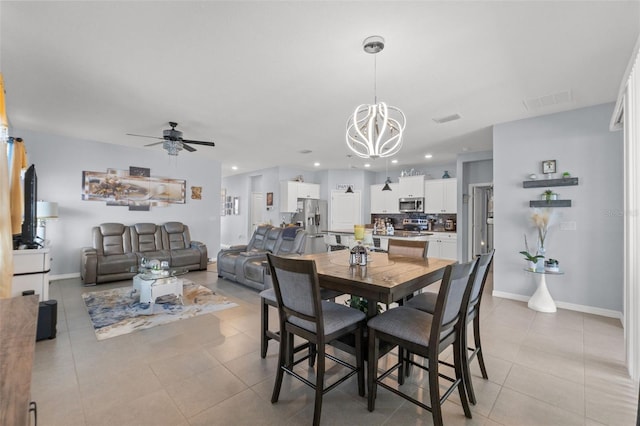 13301 Waterleaf Garden Cir, Riverview, FL 33579 - dining space with light tile patterned floors, a chandelier, a ceiling fan, and recessed lighting