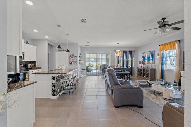 13301 Waterleaf Garden Cir, Riverview, FL 33579 - living area featuring plenty of natural light, a ceiling fan, recessed lighting, and light tile patterned flooring