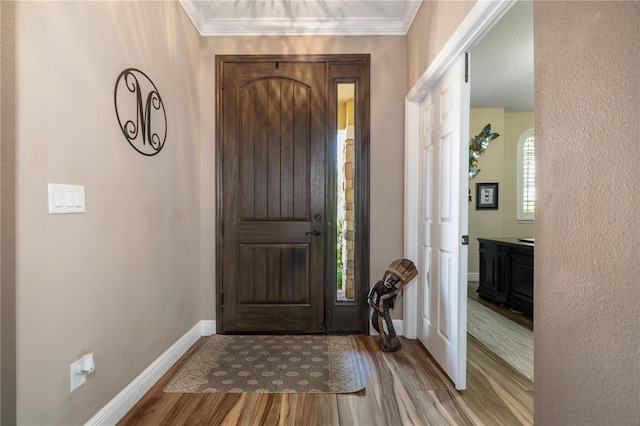165 Mobbly Bay Dr, Oldsmar, FL 34677 - foyer entrance with wood finished floors and ornamental molding