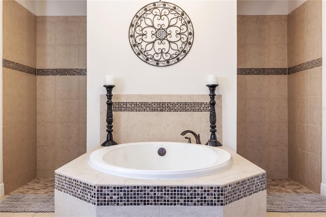 165 Mobbly Bay Dr, Oldsmar, FL 34677 - bathroom featuring a garden tub, tile patterned flooring, and a walk in shower