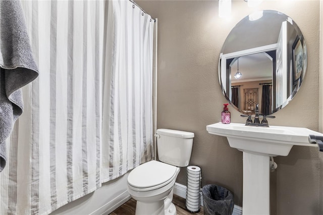 165 Mobbly Bay Dr, Oldsmar, FL 34677 - bathroom with wood finished floors and shower / bath combo