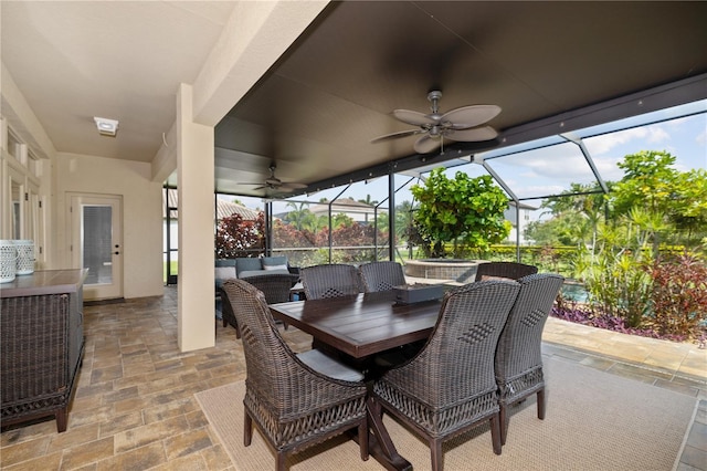 165 Mobbly Bay Dr, Oldsmar, FL 34677 - view of patio / terrace with a ceiling fan, an outdoor hangout area, glass enclosure, and outdoor dining space