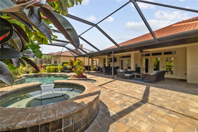 165 Mobbly Bay Dr, Oldsmar, FL 34677 - view of swimming pool with french doors, a ceiling fan, an outdoor hangout area, a patio area, and a lanai