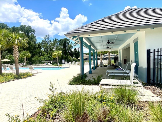 2175 Old Mining Rd, Lakeland, FL 33801 - view of patio with a ceiling fan and a community pool