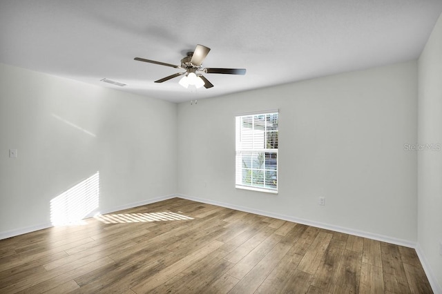 103 Whippoorwill Dr, Palm Coast, FL 32164 - unfurnished room with a ceiling fan and wood finished floors