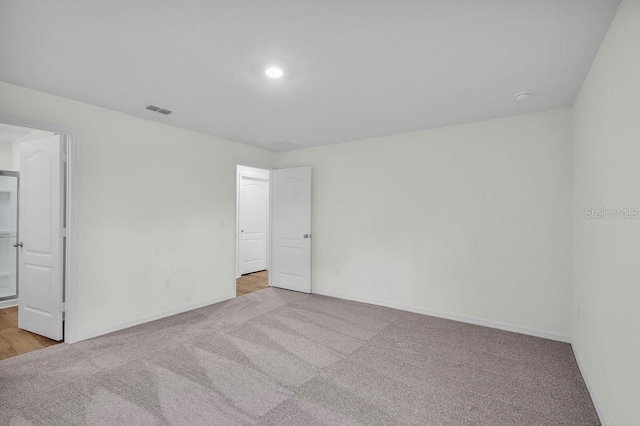 103 Whippoorwill Dr, Palm Coast, FL 32164 - unfurnished bedroom featuring carpet flooring and recessed lighting