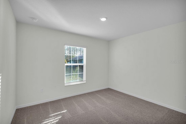 103 Whippoorwill Dr, Palm Coast, FL 32164 - empty room with carpet flooring and recessed lighting