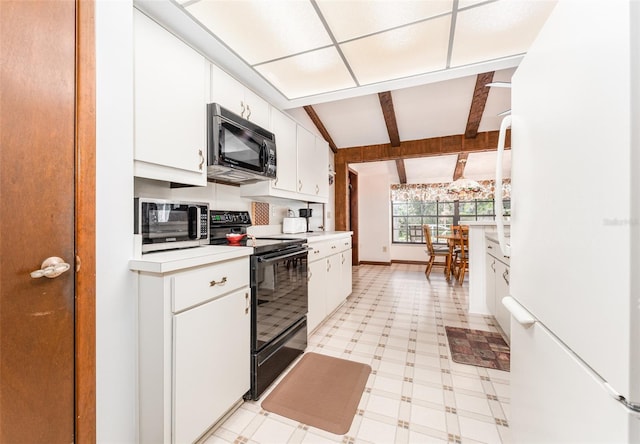 11307 Sandpine Rd, Riverview, FL 33569 - kitchen featuring black appliances, light flooring, light countertops, and white cabinets