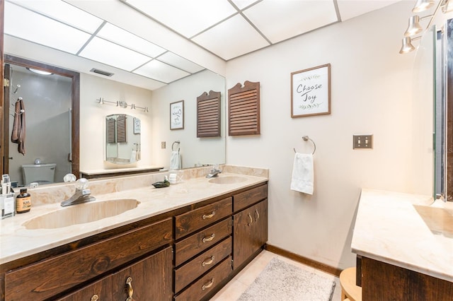 11307 Sandpine Rd, Riverview, FL 33569 - bathroom with double vanity, tile patterned flooring, and a drop ceiling
