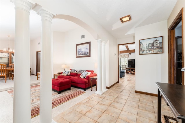 11307 Sandpine Rd, Riverview, FL 33569 - corridor with decorative columns, arched walkways, light tile patterned floors, and light carpet
