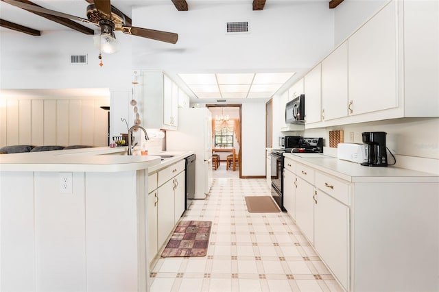 11307 Sandpine Rd, Riverview, FL 33569 - kitchen featuring range with electric cooktop, black microwave, dishwashing machine, light flooring, and light countertops