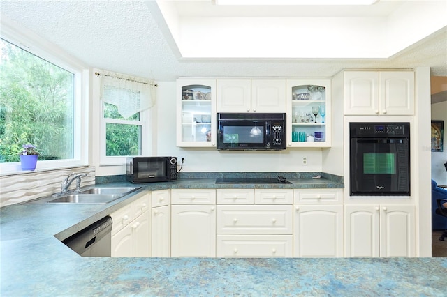 15917 Dover Cliffe Dr, Lutz, FL 33548 - kitchen featuring black appliances, glass insert cabinets, white cabinetry, and dark countertops