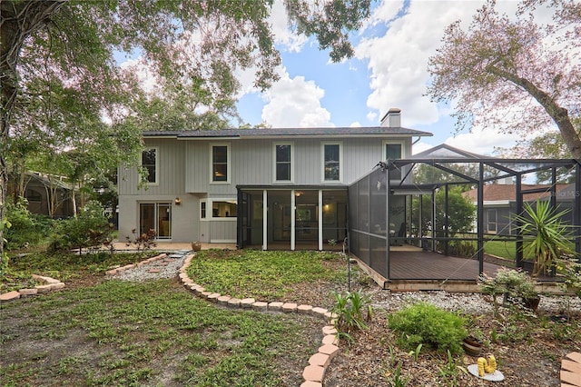 15917 Dover Cliffe Dr, Lutz, FL 33548 - rear view of house featuring a chimney, a lanai, and a deck
