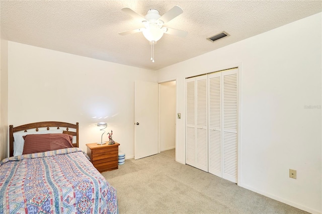 15917 Dover Cliffe Dr, Lutz, FL 33548 - bedroom featuring carpet flooring, a closet, a ceiling fan, and a textured ceiling