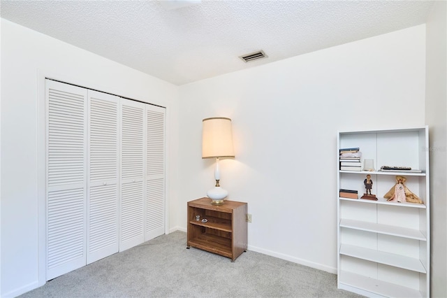 15917 Dover Cliffe Dr, Lutz, FL 33548 - bedroom with carpet, a closet, and a textured ceiling