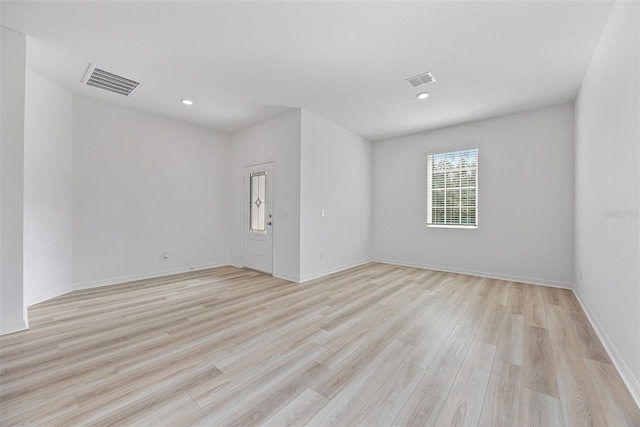 247 Big Sioux Dr, Poinciana, FL 34759 - empty room with light wood-style floors and recessed lighting