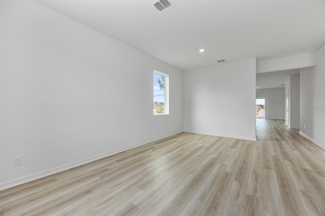 247 Big Sioux Dr, Poinciana, FL 34759 - empty room with plenty of natural light, light wood-type flooring, and recessed lighting