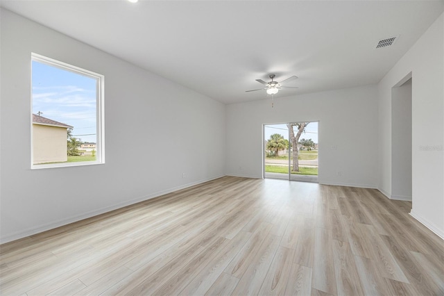 247 Big Sioux Dr, Poinciana, FL 34759 - spare room featuring ceiling fan and light wood finished floors
