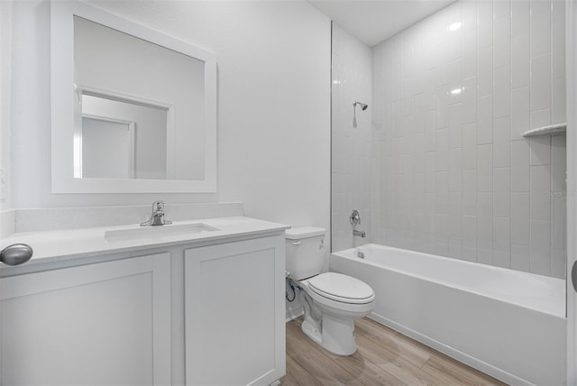 247 Big Sioux Dr, Poinciana, FL 34759 - bathroom featuring wood finished floors, vanity, and bathtub / shower combination