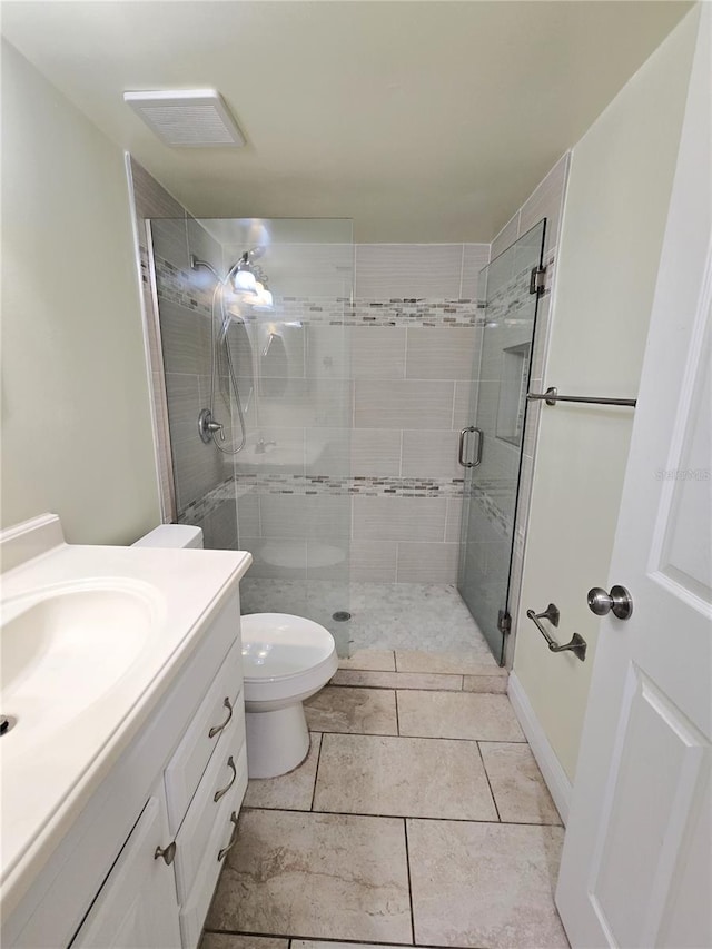 8300 Bardmoor Blvd Unit 110, Seminole, FL 33777 - bathroom featuring vanity, a shower stall, and tile patterned floors