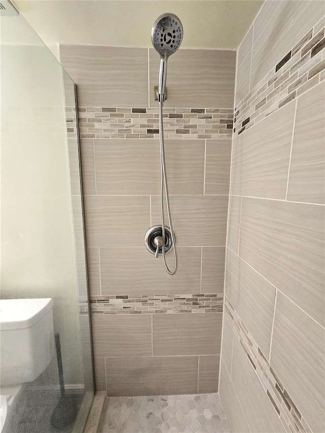 8300 Bardmoor Blvd Unit 110, Seminole, FL 33777 - bathroom featuring a shower stall and toilet