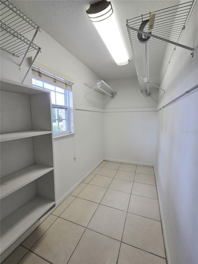 8300 Bardmoor Blvd Unit 110, Seminole, FL 33777 - walk in closet featuring light tile patterned floors