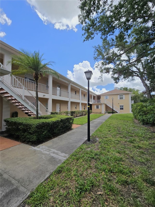 8300 Bardmoor Blvd Unit 110, Seminole, FL 33777 - view of green lawn with stairway