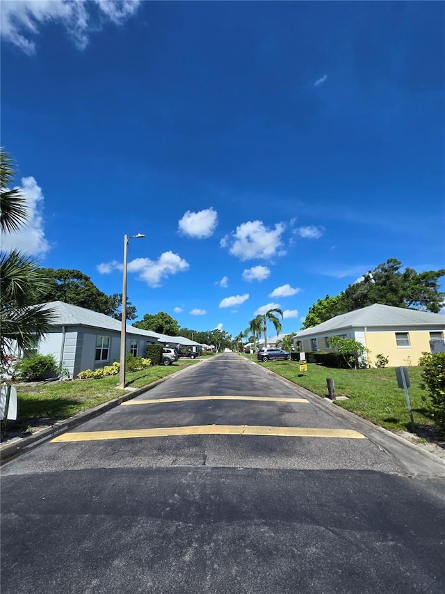 8300 Bardmoor Blvd Unit 110, Seminole, FL 33777 - view of road featuring street lights, curbs, and a residential view