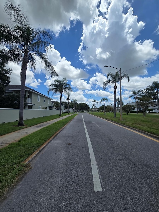 8300 Bardmoor Blvd Unit 110, Seminole, FL 33777 - view of asphalt street with street lights, sidewalks, and curbs