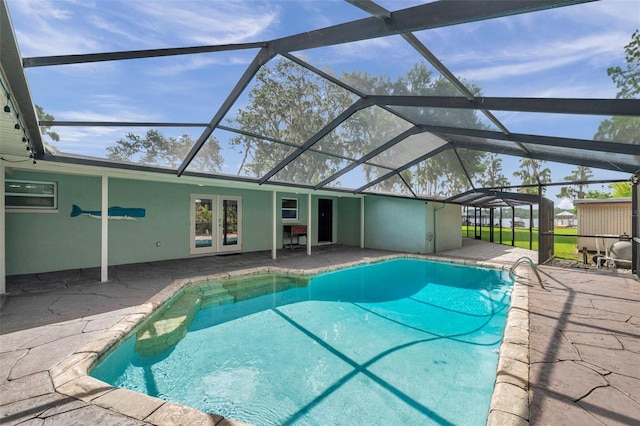 21906 Shamu Dr, Land O Lakes, FL 34639 - outdoor pool with french doors, a patio area, and glass enclosure