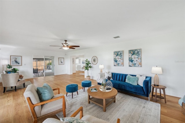 21906 Shamu Dr, Land O Lakes, FL 34639 - living room featuring light wood-style floors and ceiling fan