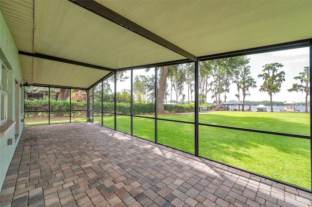 21906 Shamu Dr, Land O Lakes, FL 34639 - unfurnished sunroom with a water view