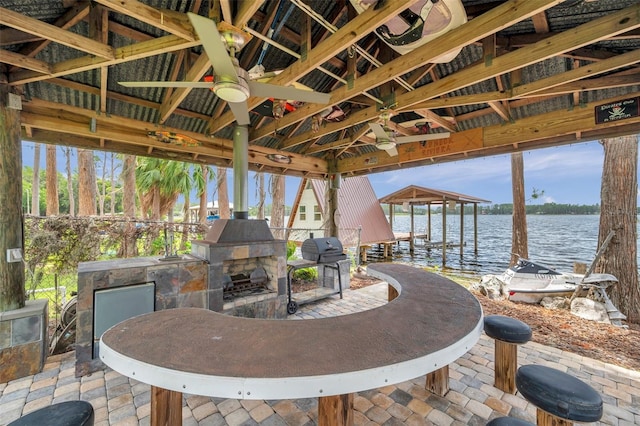 21906 Shamu Dr, Land O Lakes, FL 34639 - view of patio featuring a water view, a gazebo, grilling area, a boat dock, and boat lift