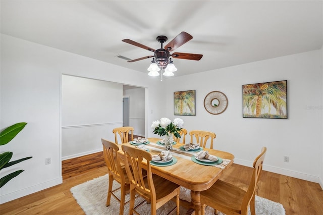 21906 Shamu Dr, Land O Lakes, FL 34639 - dining space with ceiling fan and light wood-style floors