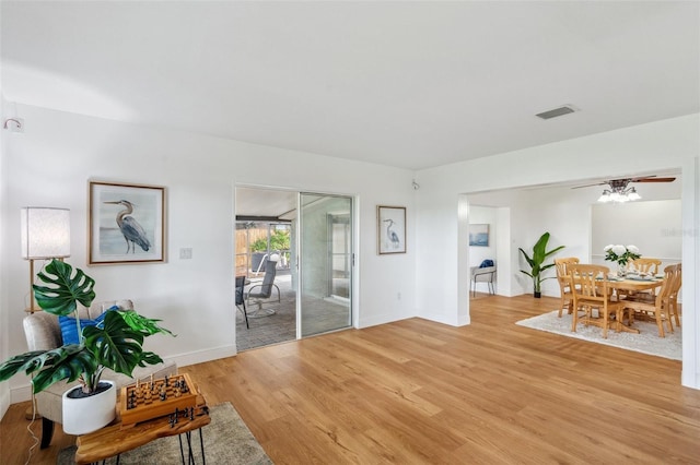 21906 Shamu Dr, Land O Lakes, FL 34639 - living area with light wood-style floors and baseboards