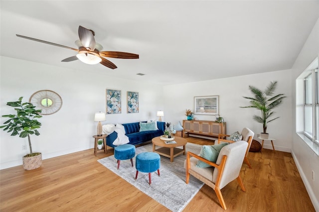 21906 Shamu Dr, Land O Lakes, FL 34639 - living area featuring wood finished floors and ceiling fan